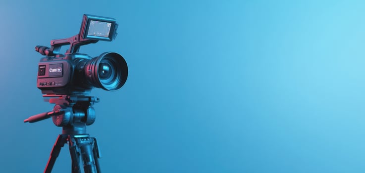 The camera set against a blue background with soft lighting and modern aesthetics. photo
