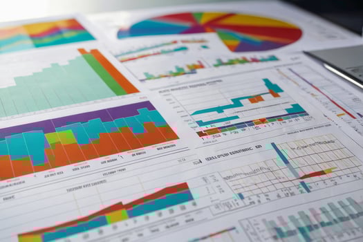 Colorful charts and graphs on white table background for data analysis and presentation. photo