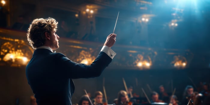The conductor leading the orchestra in a mesmerizing musical performance. photo