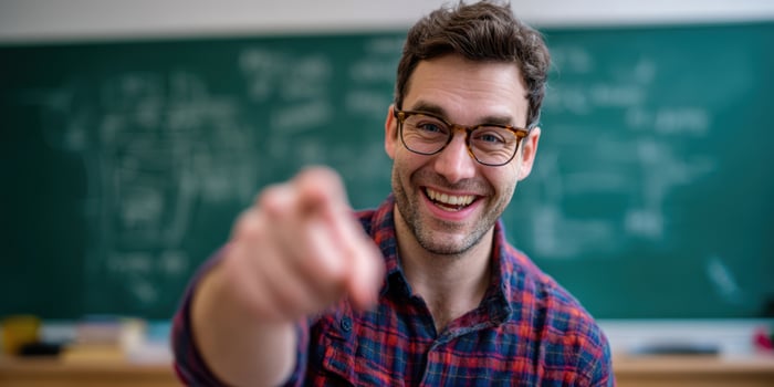The smiling teacher engaging students with encouragement and enthusiasm photo