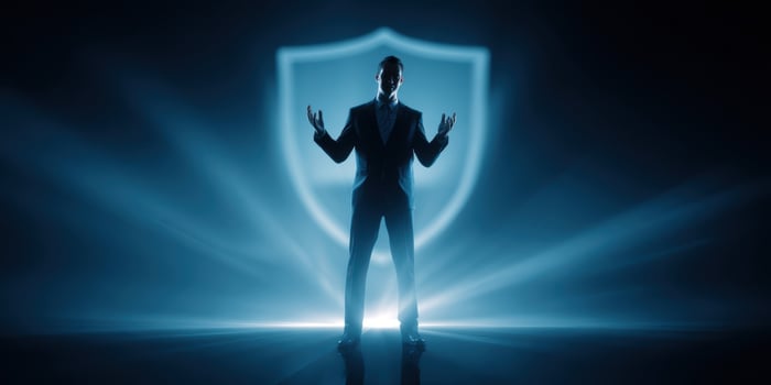 The businessman standing confidently behind a shield symbolizing security and protection. photo