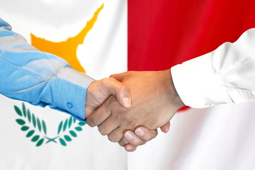 Handshake on Cyprus and Monaco flag background. photo