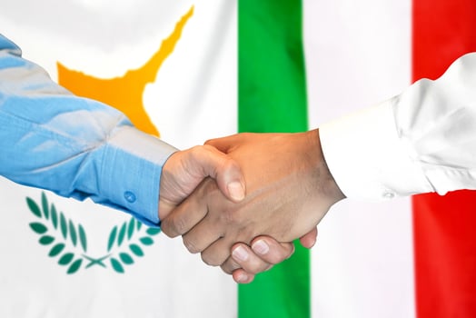 Handshake on Cyprus and Italy flag background. photo