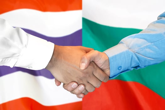 Handshake on Thailand and Bulgaria flag background. photo