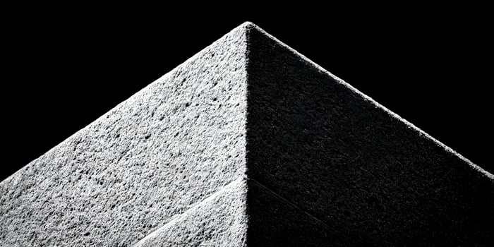 Close up view of a textured pyramid corner in black and white photo