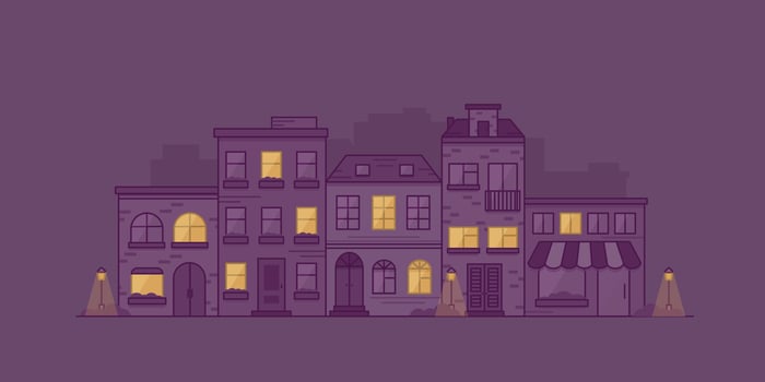 Cityscape with townhouses, lanterns and bushes at night. Town street with building facades. Vector illustration in linear style.