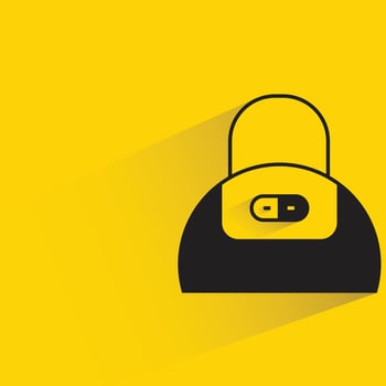 handbag icon on yellow background vector