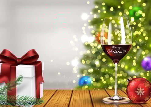Vector illustration of Christmas wine glass with gift boxes and christmas ball on light bokeh background