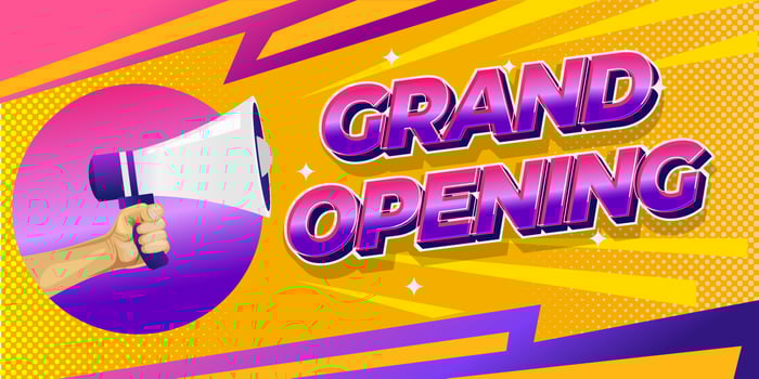 Grand opening banner with hand holding megaphone vector