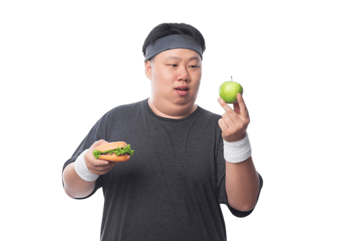 Young Asian funny fat sport man holding hamburger and green apple, Png file