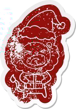 cartoon distressed sticker of a lion with christmas present wearing santa hat vector
