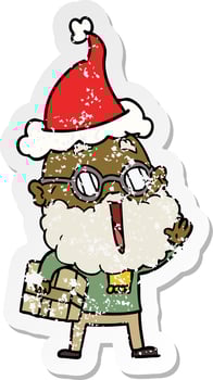 distressed sticker cartoon of a joyful man with beard and parcel under arm wearing santa hat vector