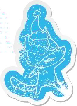 friendly cartoon distressed sticker of a wolf wearing santa hat vector