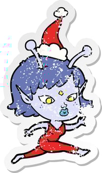 pretty distressed sticker cartoon of a alien girl running wearing santa hat vector