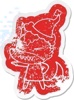 angry wolf cartoon distressed sticker of a wearing santa hat vector