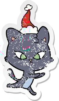 cute distressed sticker cartoon of a cat wearing santa hat vector