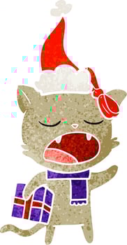 retro cartoon of a cat with christmas present wearing santa hat vector