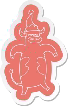 cartoon  sticker of a bull wearing santa hat vector