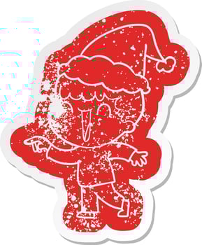 laughing cartoon distressed sticker of a man pointing wearing santa hat vector