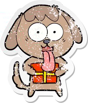 distressed sticker of a cute cartoon dog with christmas present vector