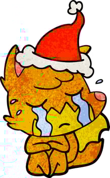 crying fox textured cartoon of a wearing santa hat vector