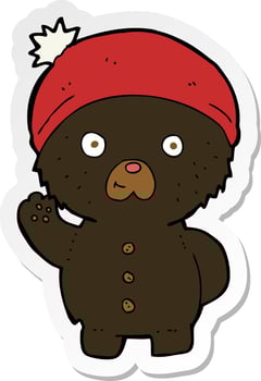 sticker of a cartoon waving black teddy bear in winter hat vector