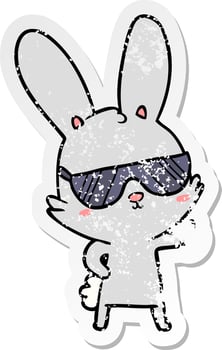 distressed sticker of a cute cartoon rabbit wearing sunglasses vector
