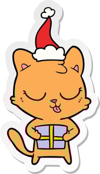 cute sticker cartoon of a cat wearing santa hat vector