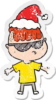 distressed sticker cartoon of a boy wearing sunglasses wearing santa hat vector
