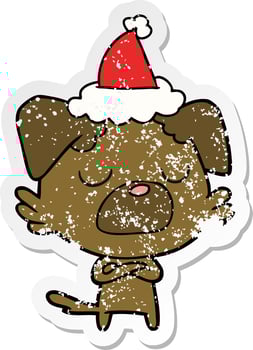distressed sticker cartoon of a dog wearing santa hat vector