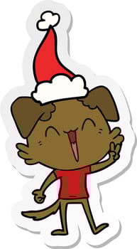 happy little dog sticker cartoon of a wearing santa hat vector
