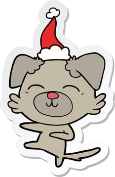 sticker cartoon of a dog kicking wearing santa hat vector
