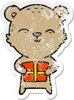 distressed sticker of a happy cartoon bear with gift vector