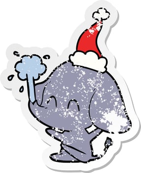 cute distressed sticker cartoon of a elephant spouting water wearing santa hat vector