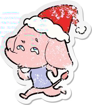 distressed sticker cartoon of a elephant remembering wearing santa hat vector