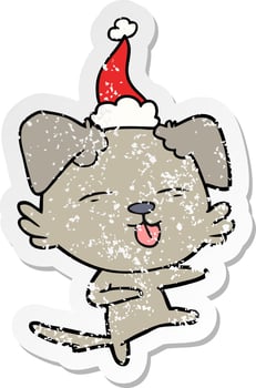 distressed sticker cartoon of a dog dancing wearing santa hat vector