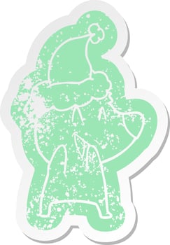 laughing polar bear cartoon distressed sticker of a wearing santa hat vector