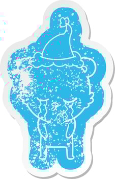 crying cartoon distressed sticker of a bear wearing santa hat vector