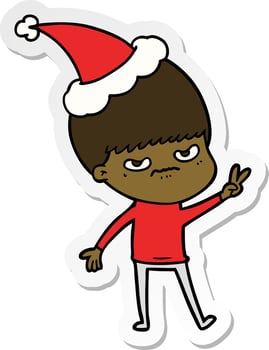 annoyed sticker cartoon of a boy wearing santa hat vector