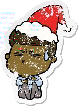 distressed sticker cartoon of a man sweating wearing santa hat vector