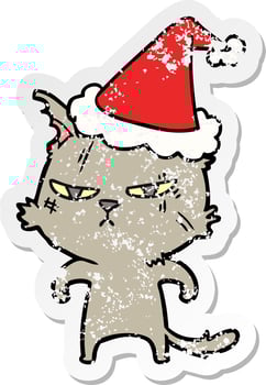 tough distressed sticker cartoon of a cat wearing santa hat vector