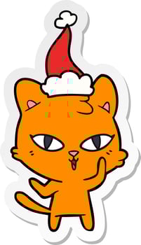 sticker cartoon of a cat wearing santa hat vector