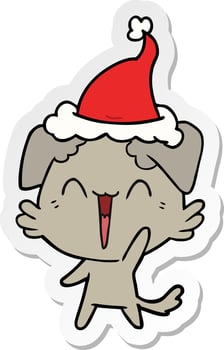 happy little dog sticker cartoon of a wearing santa hat vector