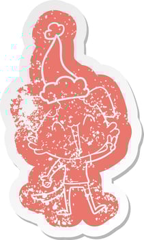 happy little dog cartoon distressed sticker of a wearing santa hat vector