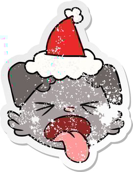 distressed sticker cartoon of a dog face wearing santa hat vector
