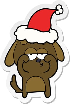 sticker cartoon of a tired dog wearing santa hat vector