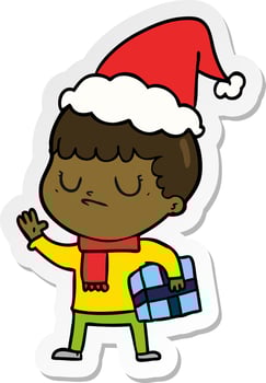sticker cartoon of a grumpy boy wearing santa hat vector