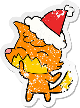 distressed sticker cartoon of a fox wearing santa hat vector