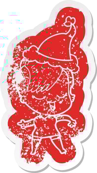 happy cartoon distressed sticker of a girl wearing santa hat vector