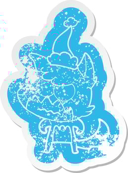 cartoon distressed sticker of a annoyed fox wearing santa hat vector